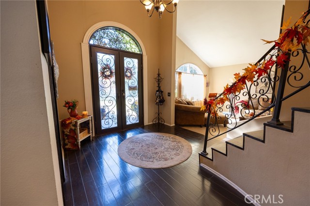 Beautiful Iron and Glass dual front doors and entryway to home.