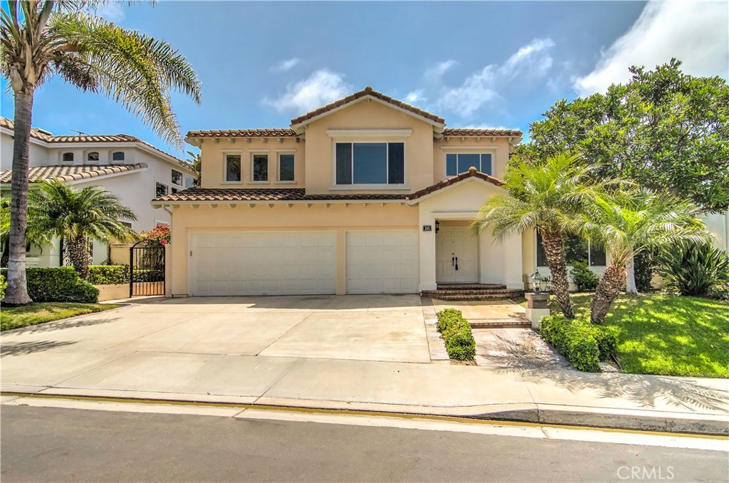 Executive residence located in the coveted Ocean Ranch guard-gated community. This lovely 3 bedroom, plus a large bonus room (could be a large 4th bedroom, office, home theatre), 4 bath home has tremendous light streaming throughout, volume ceilings and all neutral tones.  Features include a formal entry with sweeping a staircase, formal living room and dining room, and a separate famiy room with fireplace.  Brand new kitchen with shaker cabinetry, quartz countertops, new appliances and abundant storage and counterspace for the entertainer.  Downstairs primary suite with retreat, fireplace and a large bath with a dual sink vanity, seperate tub and shower and a large walk-in closet. Upstairs, there are two spacious bedrooms, each with their own bath and the huge bonus room.  Large 3-car garage with plenty of storage and a separate laundry room. The backyard offers soft scape and hard scape and is the perfect space for relaxing or entertaining. The home has also been re-piped. Beautiful community pool area with a playground, sports court and open space, and seasonal community events. This residence has so much to offer including award-winning schools nearby, is adjacent to the Ocean Ranch Village center, world-class resorts, golf, biking trails and just minutes to the Dana Point Harbor and Laguna Beach.