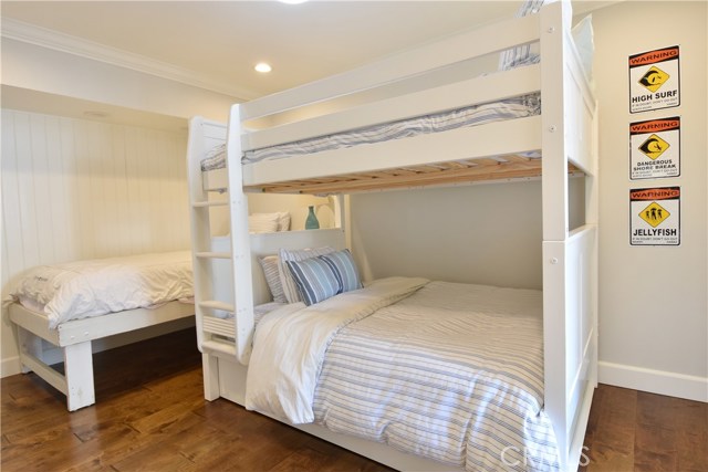 Second bedroom with full size bunk bed and separate single bed