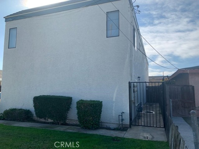 each garage has backdoor exit to gated side yard.