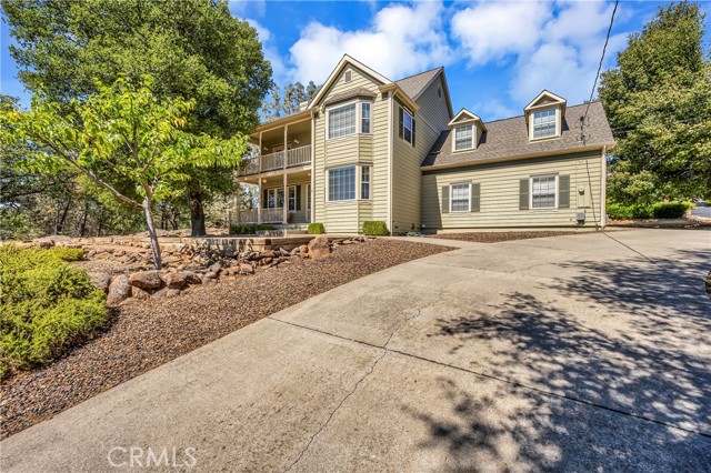 18420 Park Point Court Hidden Valley Lake, California On the Market for the first time and PRICED TO SELL! This immaculate 3 bed (+ Large Bonus Room) 2.5 bath LAKE VIEW home has 2,350 SF built in 2001. Situated on a corner parcel at the end of a quiet court with lake access nearby, enjoy the beautiful curb appeal of a custom built Craftsman style home, complete with low maintenance landscaping and covered porches to look out from. Large circular driveway offers plenty of parking for personal or recreational vehicles. Enter to find beautiful hardwood flooring and recessed lighting throughout the main level. The living room has a tiled propane fireplace + built in bookshelves/entertainment center and access to the large entertainers deck that views a rocky natural landscape with trees surrounding. Dine at the breakfast nook, breakfast bar or formal dining room! Kitchen offers updated stainless steel appliances including propane cooktop, tons of storage cabinetry in a crisp white finish and a built-in desk with storage shelving for convenience. 1/2 bath on the main level and hall bath upstairs to accommodate the 2 spacious guest bedrooms. The primary suite boasts a large walk-in closet & secondary mirrored closet + private deck access! The ensuite bathroom includes a walk-in shower, separate soaking tub and dual sink vanity. Huge bonus room would make a great office, game room or 2nd living space! New interior paint with exterior done in recent years and many upgrades including windows, doors, toilets and more. Schedule your viewing of this special home today!