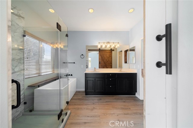 Leading into the primary bathroom with huge walk in shower and separate soaking tub. Dual sinks and huge walk-in closet complete your dream sanctuary!