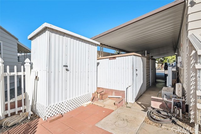 Storage Sheds conveniently located by the carport.