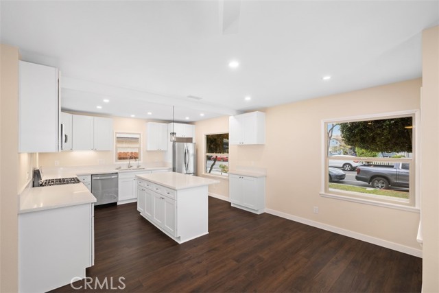 Beautiful light and bright, open concept kitchen featuring all new stainless steel appliances, new cabinets, reverse osmossis water bar seating and dining room.