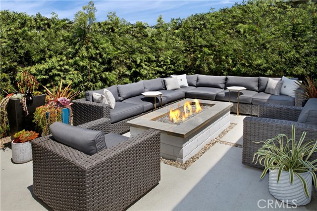 Mature landscaping allows for privacy and intimacy. Natural gas fire pit increases ambiance and warmth for evening enjoyment.