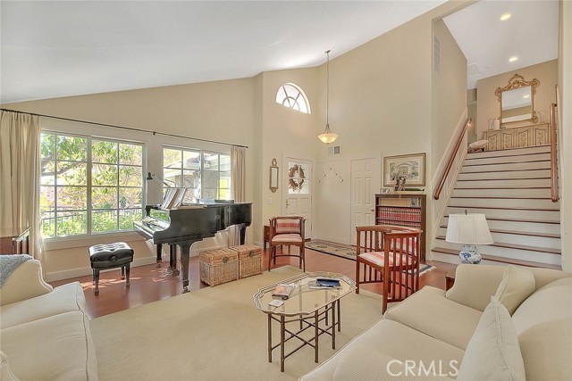 Living room and stairs to 3 upper bedrooms