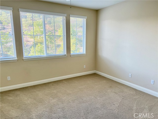 Neutral paint of larger bedroom upstairs.