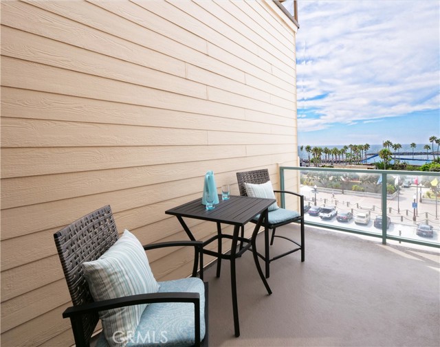 L Shaped Patio Accessed from Living Room and Primary Bedroom