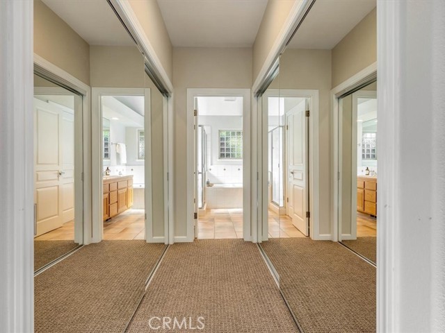 Two of the three closets in the primary suite.