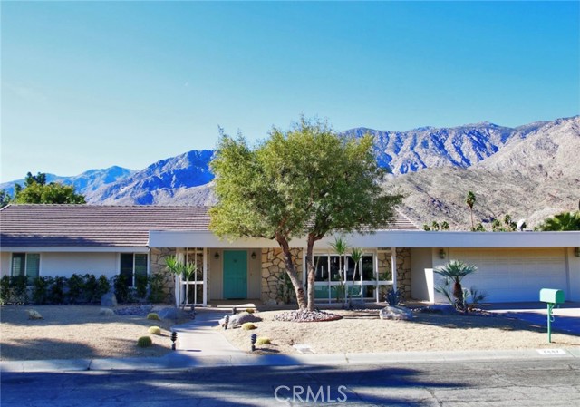 2447 S Via Lazo Palm Springs, California Sun filled Palm Springs home with style that provides 4 bedrooms, 2.75 bath, 2350 sq ft home, 11,761 lot on the 6th fairway. A backyard with privacy, however, not compromising your view so enjoy the amazing pool to relax in during the day, enjoy the stunning sunset while having dinner under your covered patio at night, grab a cup coffee in the morning while admiring the San Jacinto Mountain Range or schedule a round of golf on the prestigious Indian Canyons Golf Course. The possibilites are endless. This Mid Century designed home has a wood burning fireplace with the original brick enclosure and is the centerpiece for the large living room. The kitchen is strategically located to provide easy dining and living room access all while maintaining a perfect view of the backyard, pool, golf and mountain range. Another great feature is that all bathrooms have pool and backyard access. Bathrooms have been updated.