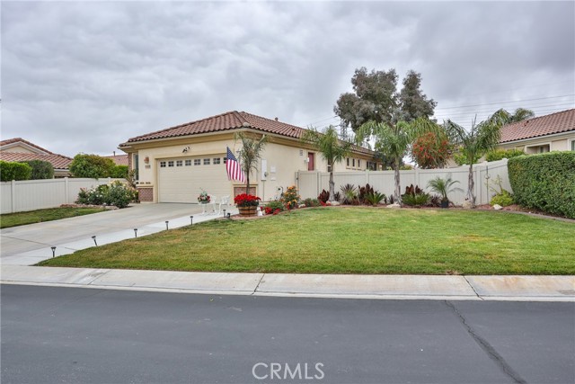 1639 Snowberry Road Beaumont, California Welcome to Solera at Oak Valley Greens 55+ Community. This beauty has it all. Pride of ownership definitely shows! The open floor plan consists of 2 good sized bedrooms and a bonus room that has a custom built in desk that is currently being used as an office, but it could be a craft room, reading room, whatever your need is. The living room is open to the dining area and kitchen. There are high ceilings and porcelain tile flooring that looks like wood throughout the home. The main bedroom has a walk in closet and an elegant bathroom with custom tiled walk in shower with multiple shower heads for that spa feeling. The kitchen features Corian counter tops, breakfast bar and beautiful custom backsplash. There is a dishwasher, gas stove, micro hood and refrigerator. There is also a pantry for storage. The laundry room is just off of the kitchen and garage in it's own room w/ a wash basin. The washer and dryer stay with the home. The living room is spacious and has a slider that leads out to the beautiful serene backyard. With a lot size of almost 7,000 sf. and vinyl fencing around the back yard there is plenty of room for gardening, entertaining etc. There are many fruit trees: Apple, nectarine, cherry, orange, cumquat, a grapevine, roses etc. There is a concrete patio just off of the living room and a deck made out of Trex material. The side yard offers plenty of room for more gardening as well. Check out the garage!, Clean, Clean, Clean! The flooring has an epoxy finish and there is plenty of room for all of your toys and for doing your projects. You don't want to miss this gem!