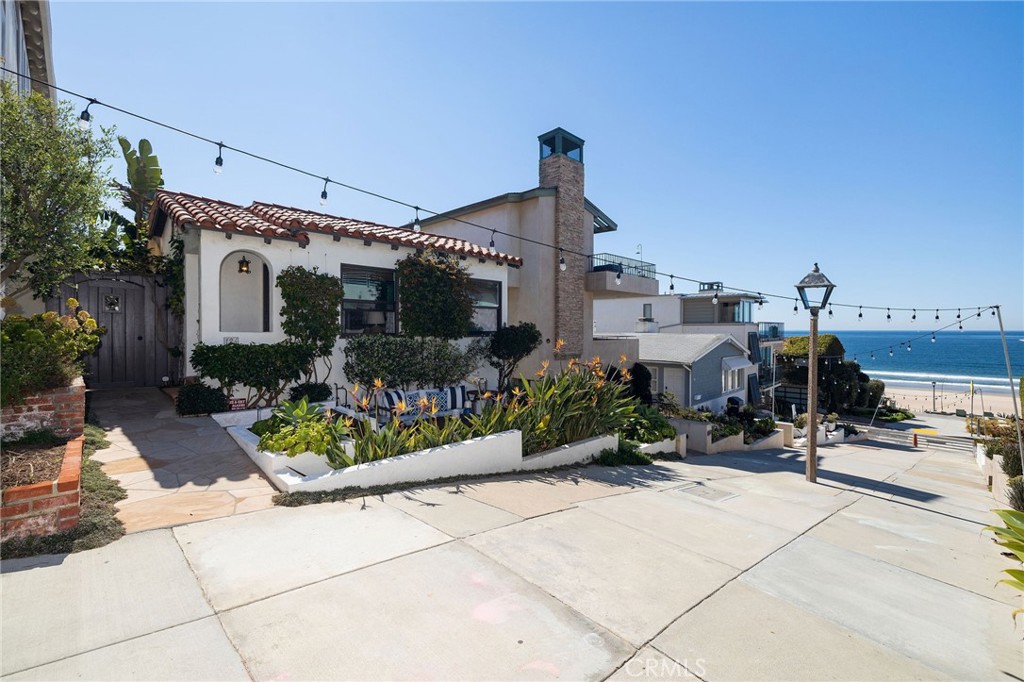 Whether you’re on the hunt for a multi-generational compound or simply looking to add to your real estate portfolio, be sure to check out this rare opportunity. These two exceptional residences, being sold together, are ideally located just steps away from the Manhattan Beach Strand in the picturesque Sand Section. The first home enjoys walk street frontage while the second adjacent dwelling is accessed from the alley. Live in one and rent the other or utilize them both as income-generating properties. A sun-drenched porch overlooking 17th Street welcomes you to the front Spanish-style residence. Take in the remarkable white-water and sand views before entering this 2 bedroom stunner that exudes casual beach style with tons of natural light, gleaming hardwood floors, and comfortable gathering spots. You’ll have plenty of white cabinetry, ample prep space, and all the appliances you need in the galley-style kitchen. Glass sliders whisk you out to a shaded courtyard where chilly nights are best spent relaxing around the fire pit. Treat yourself to breathtaking vistas with white-water and sand views from the massive 681 square foot rooftop deck of the rear abode that also provides you with 2 bedrooms. This modern coastal haven has walls of glass that usher abundant sunlight across the wide-plank hardwood flooring. White European-style cabinetry is contrasted by blue-gray granite countertops in your luxe kitchen equipped with high-end Bosch stainless steel appliances. A walk-in closet and tastefully tiled ensuite await you in the primary retreat. Take the spiral staircase to the roof where you can immerse yourself in the salt air, sea breezes, and postcard panoramas. It’s a picture-perfect spot for alfresco meals. Additional amenities include bathroom marble countertops, sleek electric shades in the main living areas, Sonos system throughout home and rooftop deck, and 6-camera surveillance system with remote access alarm. With all that these amazing homes have to offer, what are you waiting for? Come for a tour before someone else does!
