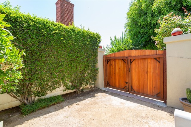 gate to front driveway, view from side yard