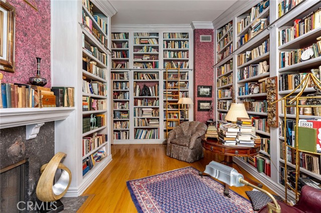Private library with Custom shelves and ladder