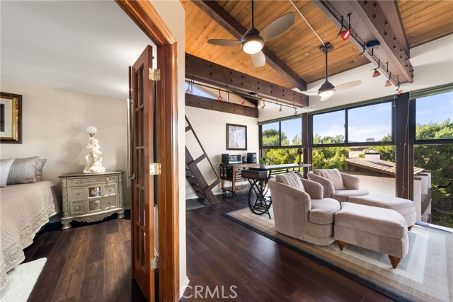 High ceilings and gorgeous wood beams make this home a must see!