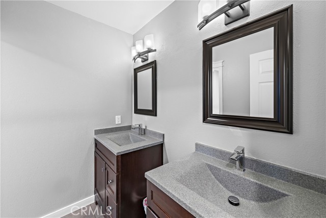Upstairs secondary bathroom with dual vanities. The toilet and shower/tub are separate making it easy for more than one person to get ready at a time.