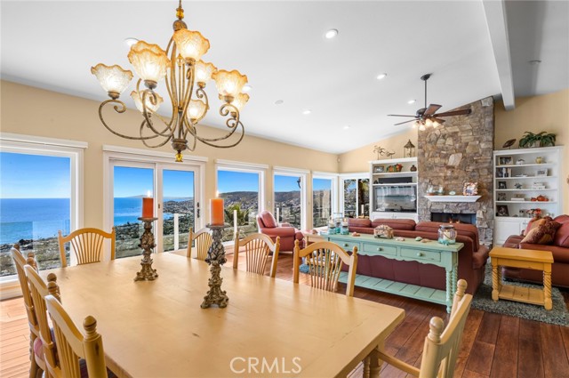 Entertaining the ones you love is easy in an open-concept main level that hosts a vaulted ceiling, a spacious wraparound view deck, a dining room, and a great room with fireplace that presents a delightful gathering place for creating lifelong memories while enjoying tranquil ocean views.