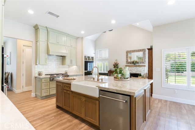 The beautiful wood grain in the white oak custom cabinetry ties in perfectly with the rich colors of this easy to maintain flooring.