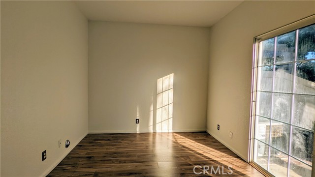 Bedroom 1 - downstairs with doors to rear yard