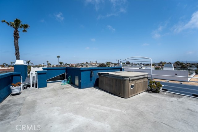 Unit 1 rooftop deck with hot tub - facing east.