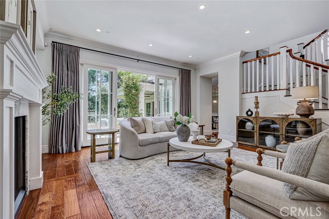 Formal Living Room Area with French Door Access to Backyard Patio Area