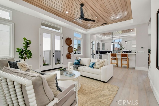 LIVING ROOM TO KITCHEN WITH SEATING AT THE COUNTER