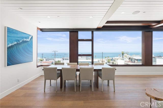 Straight on view from top of stairs at dining room and ocean forever