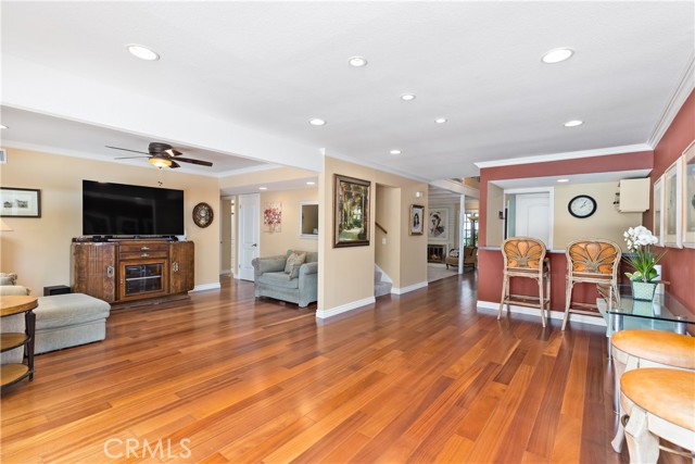 Open floor plan concept for kitchen, family room, and third area with Brazilian hardwood flooring.