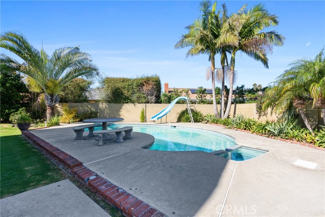 The enormous entertainer’s backyard with nicely manicured landscaping, you will find everything you would expect including a sparkling pool and hot tub and a gas firepit!