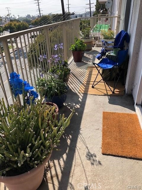 Sunny balcony stretching besides the the dining room and the living room areas.