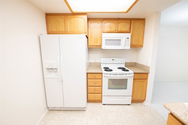 Full convenience kitchen with granite counter tops