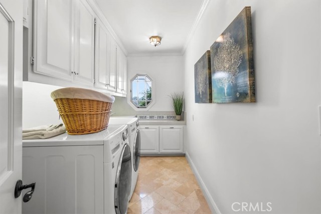 Laundry Room has lots of storage and countertop for folding, plus a Laundry Sink.