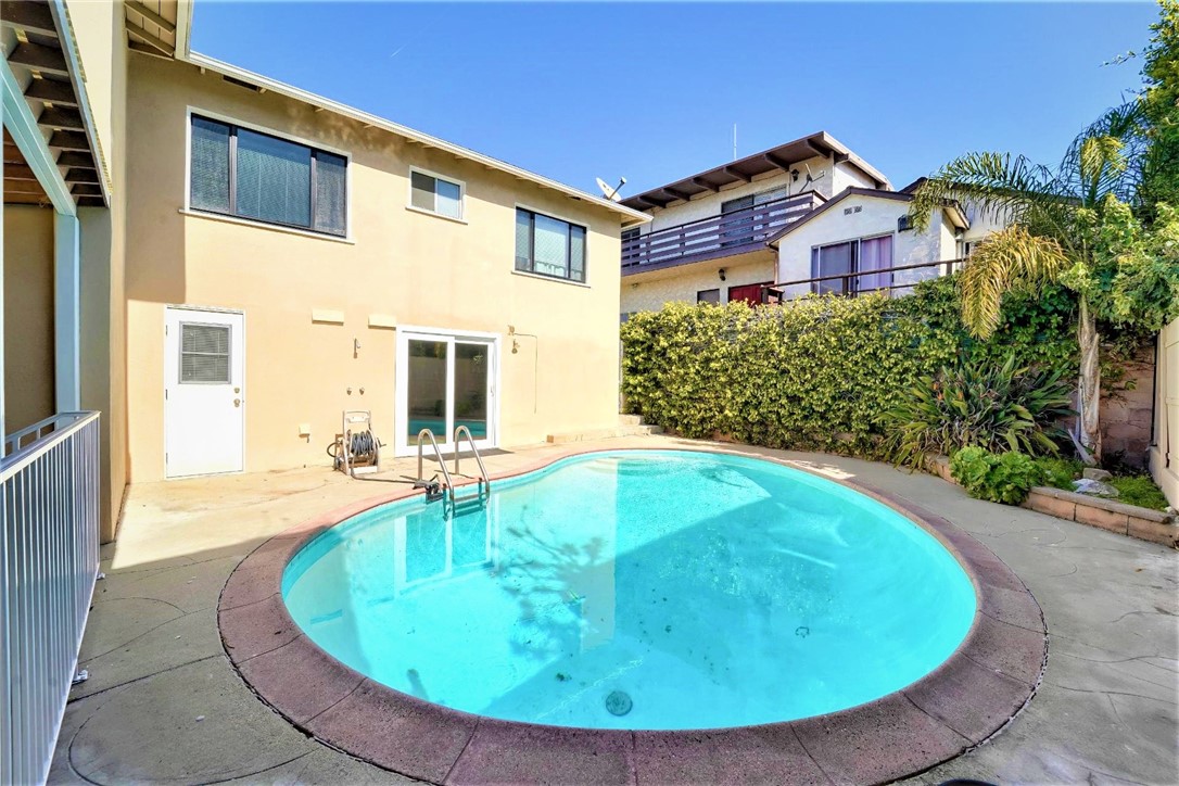 The pool which is very sheltered from the wind and elements, has a surrounding deck for chairs and loungers. To the left of the pool area is a lower level patio.