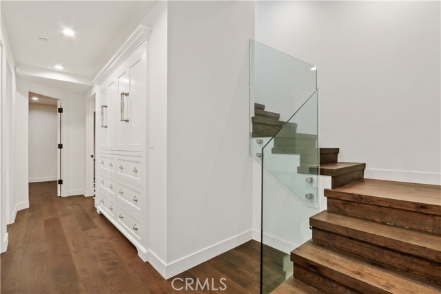 Lower level hallway leading to 3 bedrooms and laundry room