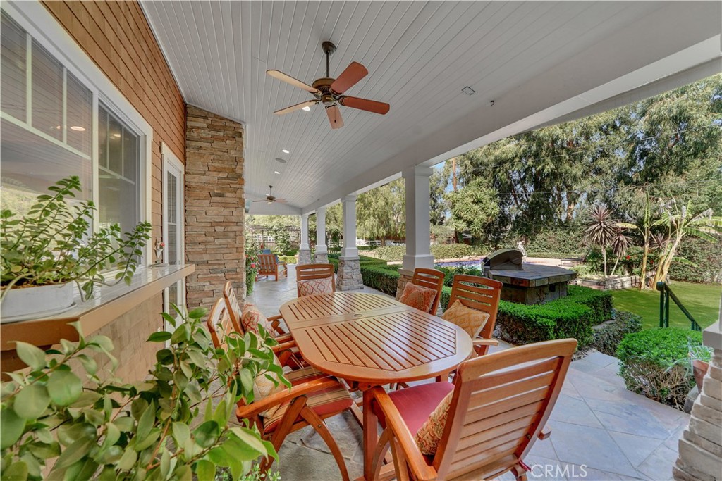 large dining area on back patio overlooking the grounds