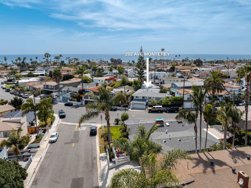 One of a Kind Charming Coastal Compound Designed by Famous Architect Eric Boucher - Just Blocks from Downtown San Clemente & Iconic Pier! Just a short stroll from vibrant downtown San Clemente and the world-famous San Clemente Pier, this rare offering features two beautifully appointed structures on a double lot, ideal for multi-generational living, rental income, or a private guest setup. The main residence is a spacious and light-filled 3-bedroom, 2-bathroom home that blends classic California charm with modern updates. There is also an attached studio to the front house that features a kitchenette, remodeled bathroom, and large private yard. Continuing with the front house, you'll enjoy open-concept living with a flowing layout, perfect for entertaining or relaxing by the beach breeze. The well-equipped kitchen, generous bedrooms, and stylishly updated bathrooms provide comfort and functionality for everyday living. Tucked away at the rear of the property is a detached 2-bedroom, 1-bathroom guest house—a fully independent unit with its own entrance, yard, kitchen, and living area. Whether used as a rental or space for extended family, this guest house offers incredible flexibility and value. Car enthusiasts and storage seekers will appreciate the oversized 4-car tandem garage, offering ample space for vehicles, surfboards, bikes, and more.
All of this sits on a generous double lot in one of San Clemente’s most sought-after neighborhoods, just minutes from boutique shopping, award-winning restaurants, coastal trails, and the beach. Don’t miss this rare opportunity to own a versatile coastal property in the heart of San Clemente!