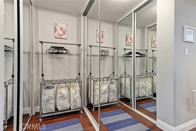 His & hers master closets with mirrored doors