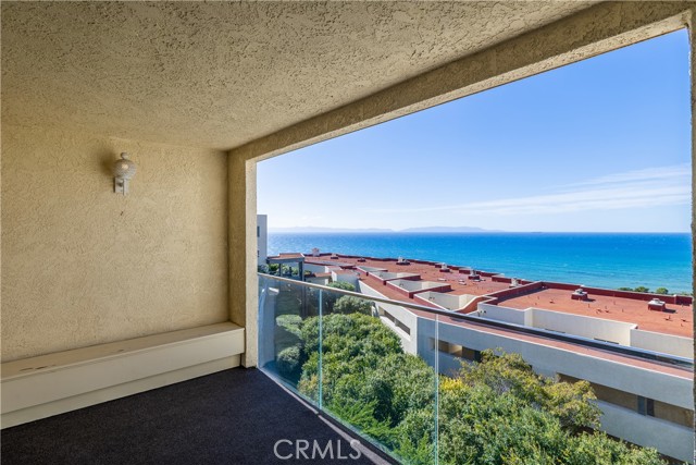 The spacious living room features a warm fireplace, wet bar, and opens to the large ocean view balcony that’s the perfect for everyday indoor-outdoor living, entertaining guests at sunset with the stunning view.