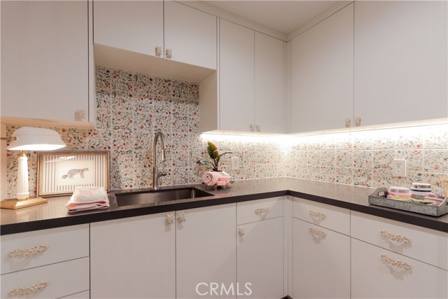Utility sink in the laundry room makes this space as functional as it is lovely.