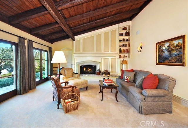 Living room with vaulted exposed-beam ceiling