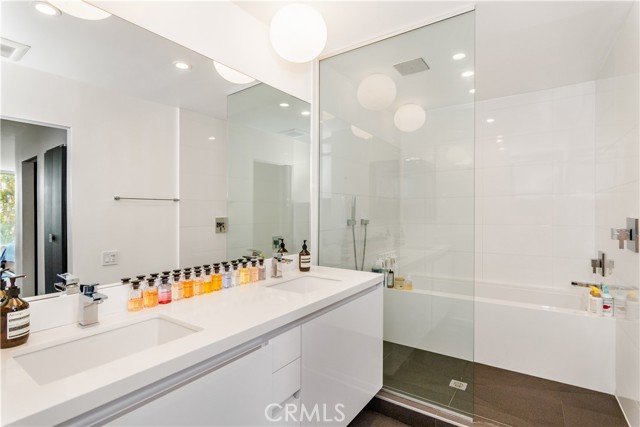 Master bathroom with quintessential soaking tub within the shower