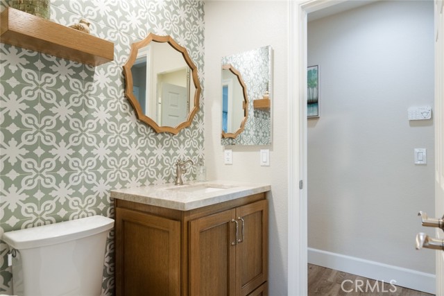This is one of 3 full bathrooms located just off the great room area. It is attached to the 4th bedroom.