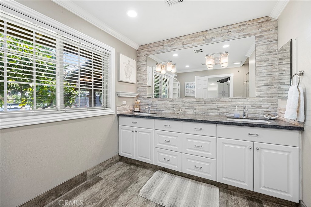 This adjoining en-suite is open and light all done in neutral colors