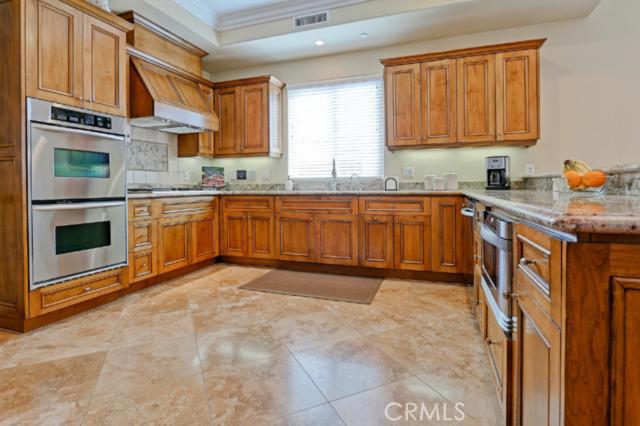 Kitchen of your dreams - double oven (one is a convection), travertine floors, walnut cabinets, stainless appliances and granite countertops. Kitchen of your dreams - double oven (one is a convection), travertine floors, walnut cabinets, stainless appliances and granite countertops.