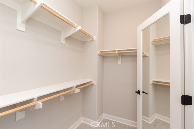 Primary bedroom walk in closet