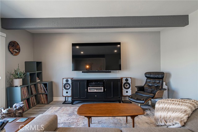 Open Living Room with wood beams.