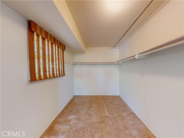 Primary bedroom walk in closet