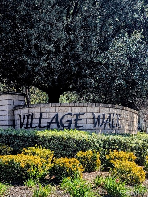 Welcome to Village Walk Townhomes in the beautiful city of Valencia, Santa Clarita. This gorgeous home provides comfort and prestige with an atmosphere of luxurious peace and tranquility. As you enter you will be greeted by the picturesque elegance of this amazing space. The formal living room area has a charming remote controlled gas fireplace, large windows with access to the courtyard style patio and a ceiling height equivalent to the second level that provides a grand feeling. The second level is a spacious open concept combination including the formal dining area with an overlook to the living area below, a kitchen with granite counters, all stainless steel appliances, an ample pantry, a breakfast bar counter and under cabinet ambient lighting all open to the family room. This level also has a powder room for your convenience while also making the space great for entertaining guests. As you continue upstairs you will see a built in workspace, a concealed laundry closet equipped with a washer dryer stackable set and the primary and secondary bedroom suites each with great closet space. This unit also has lots of natural light, new window treatments, fresh paint, luxury vinyl premium flooring, ceiling fans, upgraded light fixtures and faucets throughout and a private two car garage with direct access all securely protected with a built in fire hazard ceiling sprinkler system. The complex provides a private pool and spa lounging area with restrooms, walking and biking trails nestled in plush landscapes, located conveniently to nearby parks, and a variety of retail shopping and restaurant dining options for an extra added bonus. It is a fabulous lifestyle you definitely must experience.