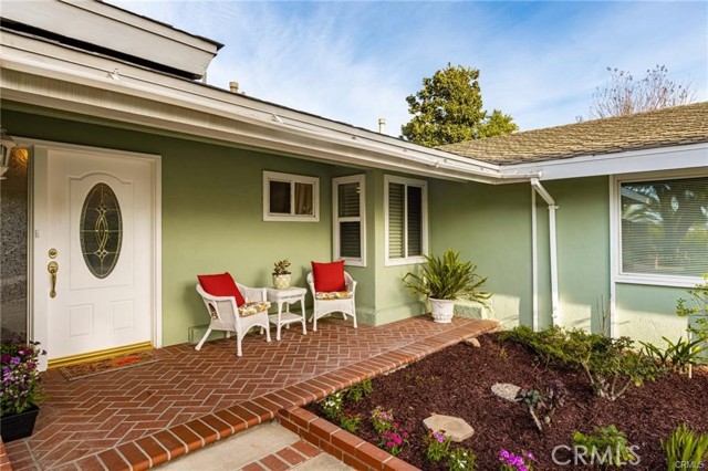 3087 N Butterfield Road Orange, California Located in the rolling hills of North Orange just above Eisenhower Park, sits this lovely single level home on a prime lot. Welcomed by a well-manicured lawn, you will stroll up a brick-lined walkway to enter this light, bright, & airy three bedroom, two-bathroom home. The living room features a cozy fireplace plus large windows with wonderful views of the hills & city lights. The immaculate kitchen is perfect for preparing meals with solid oak cabinets, Corian countertops & a spacious window showcasing the garden view plus a peek-a-boo view of the snow-capped mountains. A nice-sized family room is open to the kitchen area & features a custom-built buffet which is great for entertaining. The Master Retreat features two closets & a remodeled bathroom w/ a white vanity, mosaic floor tile, & a shower w/white subway tile. A super clean garage w/ direct access to the home has cabinets, counterspace & an epoxy coated floor. Enjoy an evening meal on the covered patio w/ views of the city lights & amazing sunsets. The 10,800 square foot lot is a gardener’s delight with beautiful rose gardens, a magnolia tree, & a scenic slope with succulents & ivy. A great location centrally located with easy access to the 57, 91, and 55 freeways, nearby shopping at the Village of Orange & is in the attendance area for the acclaimed Villa Park High and Cerro Villa Junior High Schools. This very special home has been meticulously maintained. Death On Property < 3 yrs .