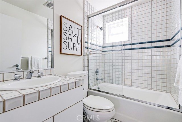 On the second level this hall bath is ideally located between two bedrooms